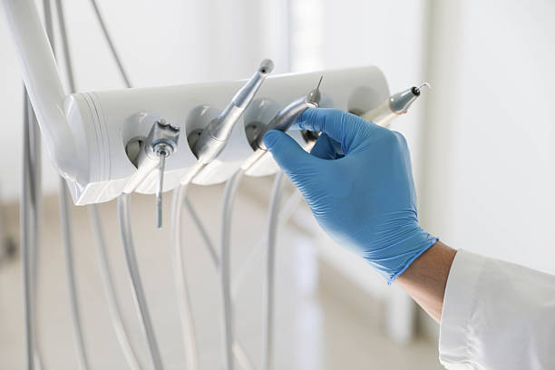 Professional Tooth Extraction technician working in Ogemaw County County, MI